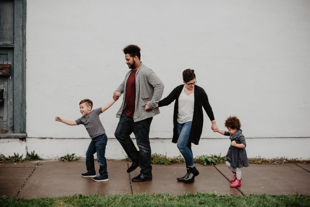 Family of four, holding hands - Our Independent Insurance Agency provides you with the right combination of financial coverage and affordability from multiple insurance companies