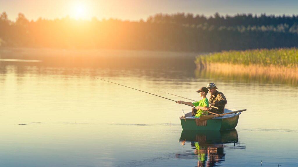 boat insurance protects your ability to have moments like this on on a lake with your son fishing