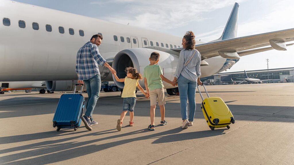 This family of four got travel insurance before they booked their flight on this plane that they are walking to